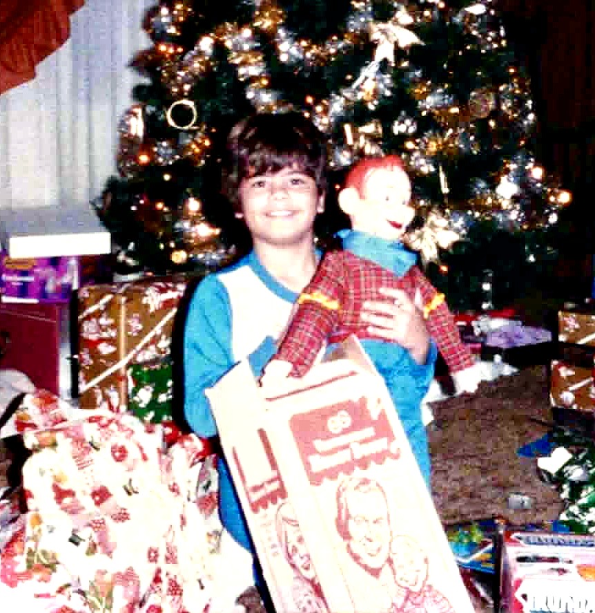 Jimmy Vee as a boy on Christmas morning with his first ventriloquist figure, a Howdy Doody