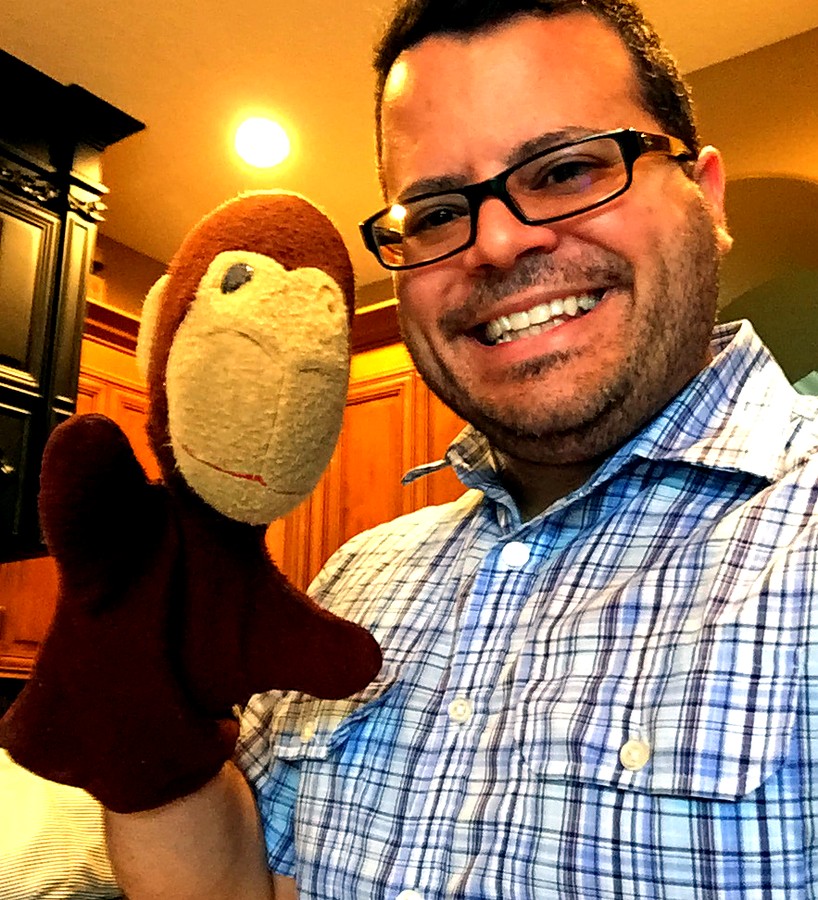 Jimmy Vee holding Mickey The Magic Monkey, his first puppet