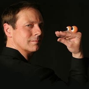 Ronn Lucas performing with a character made from his own hand